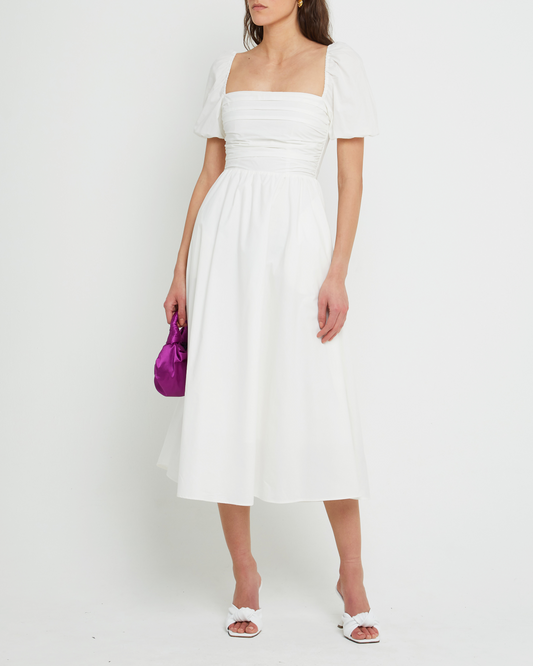 First image of River Dress, a white midi dress, square neckline, short puff sleeves, gathered bodice