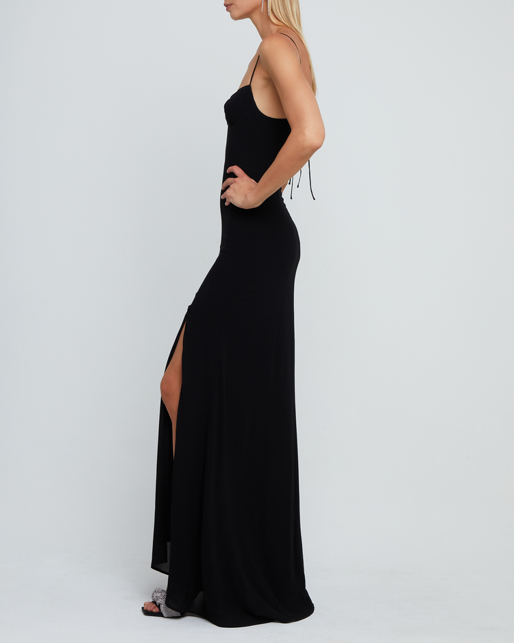 Third image of Delphi Dress, a black maxi-length bridesmaid dress with sweetheart neckline, cup detail, side slit, cupped sweetheart neckline, back zipper, back smocking, and adjustable tie string straps