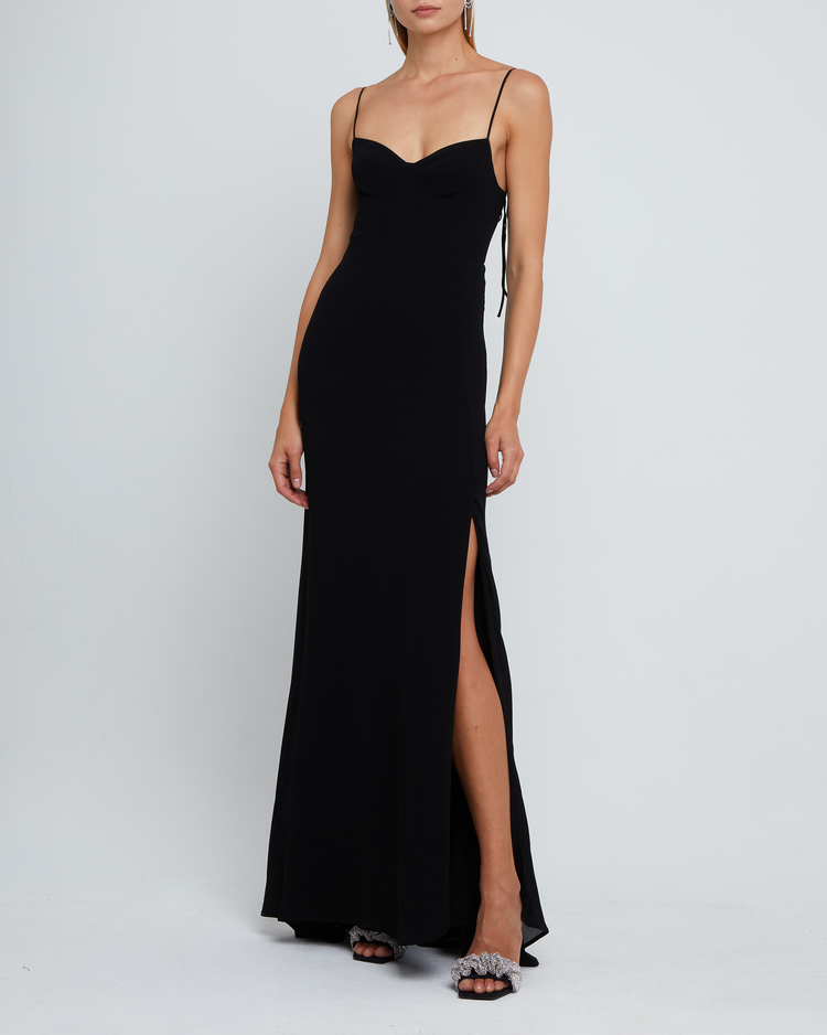 First image of Delphi Dress, a black maxi-length bridesmaid dress with sweetheart neckline, cup detail, side slit, cupped sweetheart neckline, back zipper, back smocking, and adjustable tie string straps