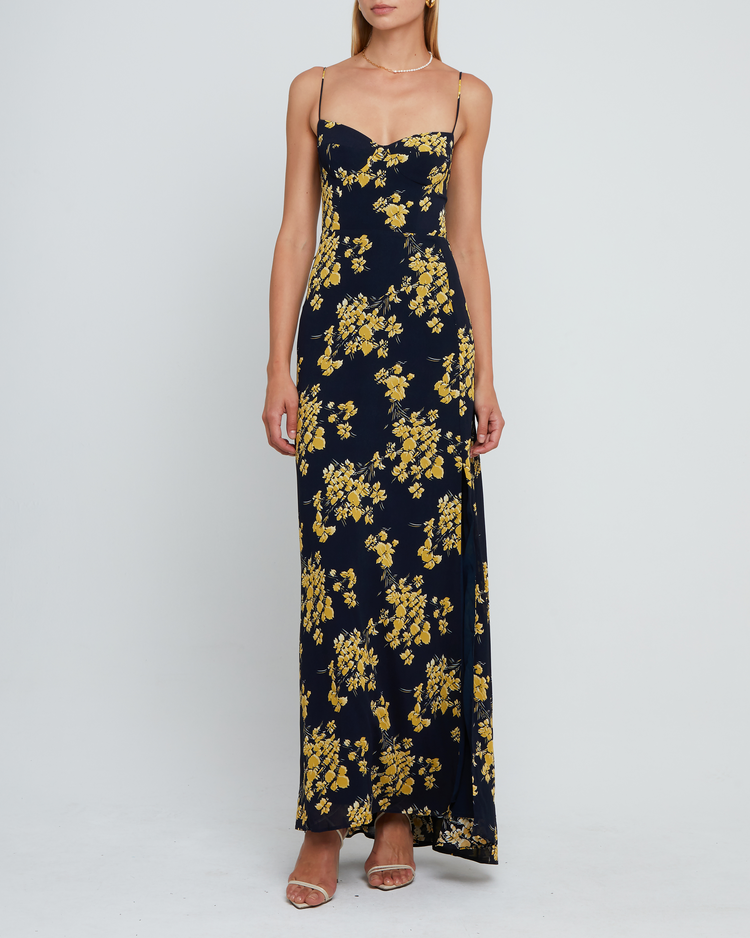 Fifth image of Delphi Dress, a navy and yellow floral maxi-length bridesmaid dress with sweetheart neckline, cup detail, side slit, cupped sweetheart neckline, back zipper, back smocking, and adjustable tie string straps